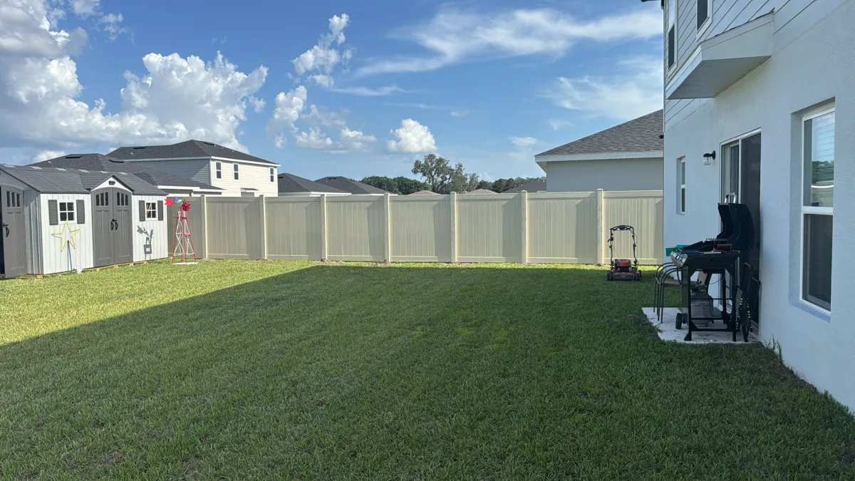 Vinyl privacy, tan condo side by Crystalline Home Improvement in Central Florida