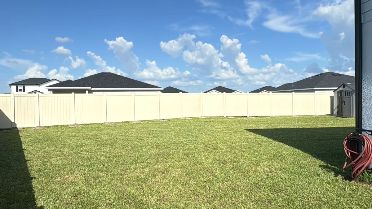 Vinyl privacy, tan shed yard by Crystalline Home Improvement in Central Florida